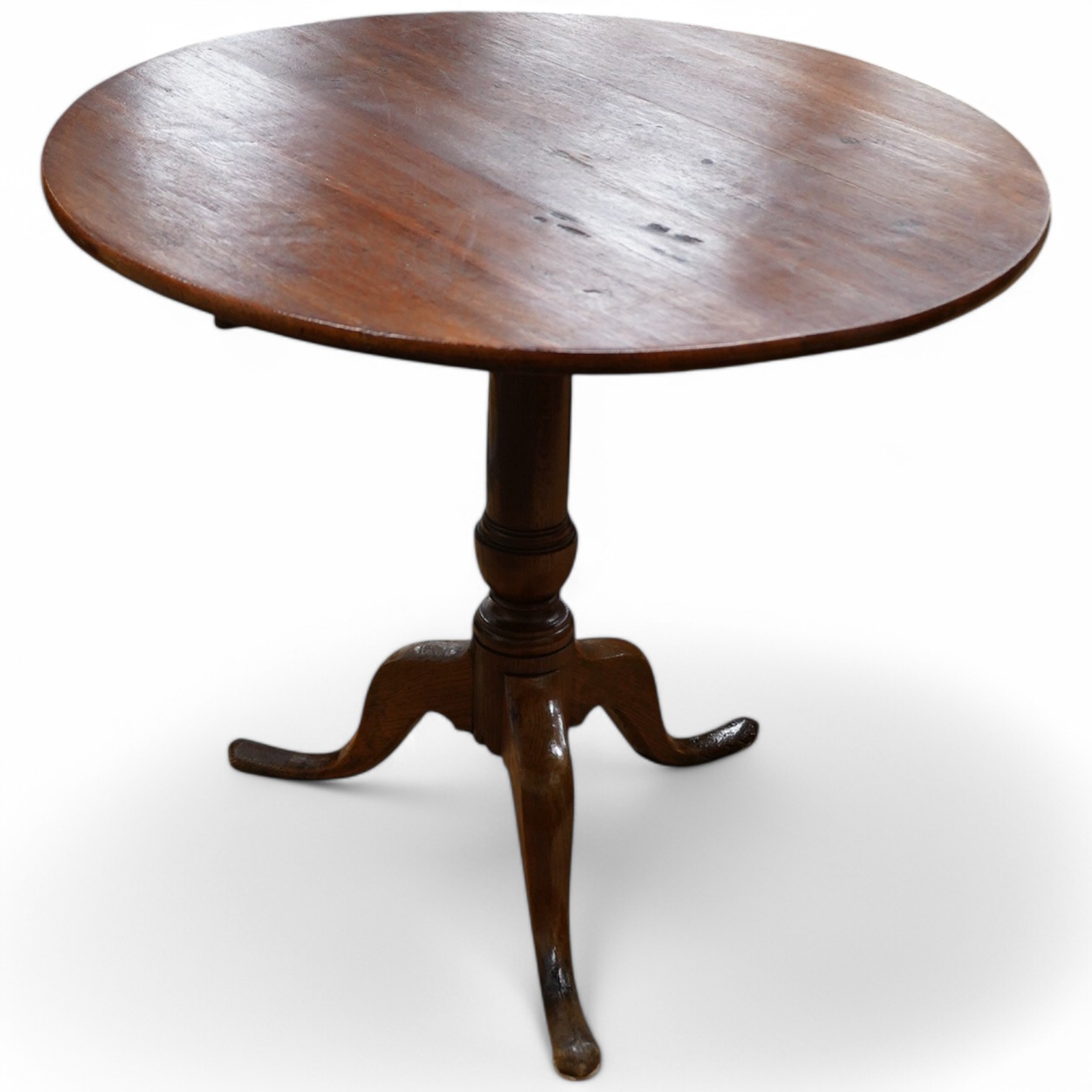 A George III circular oak tilt top tripod tea table, diameter 82cm, height 71cm. Condition - fair